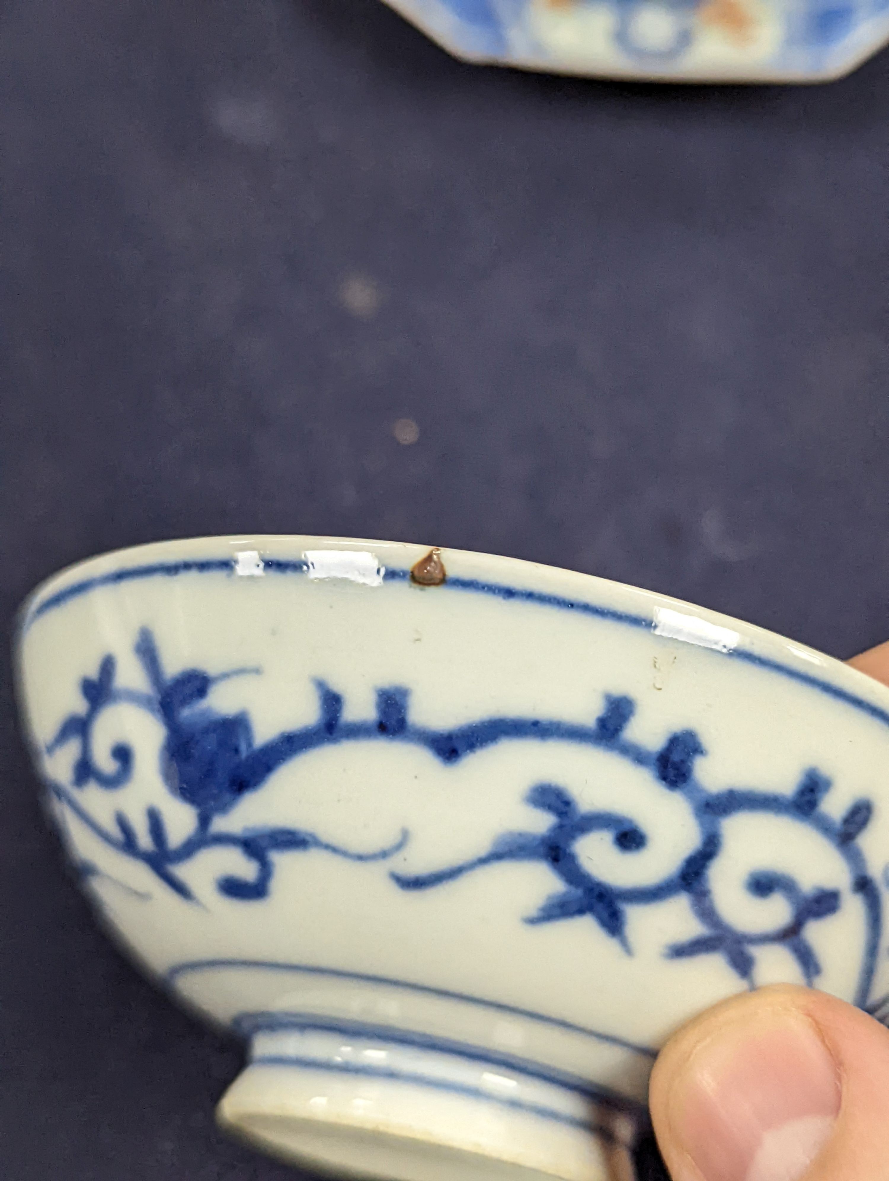 A Japanese blue and white vase, two similar dishes and a tea bowl and saucer